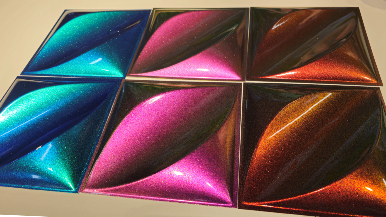 A picture of three of the silux aurora panels showing the colour travel effect